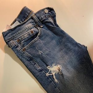 Medium blue ripped Levi jeans